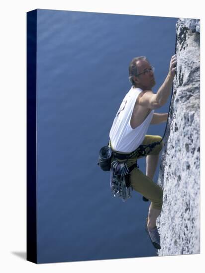 Male Rock Climber Reaching for a Grip-null-Premier Image Canvas