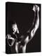 Male Runner Holding Up a Relay Baton-null-Premier Image Canvas