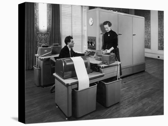 Man and a Women Working Together with a Pegasus Computer-null-Premier Image Canvas