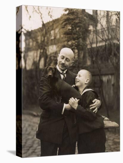 Man and Boy Holding a Dachshund-null-Premier Image Canvas