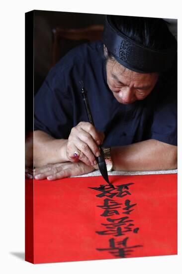 Man doing traditional Chinese writing (calligraphy) in ink using a brush, The Temple of Literature-Godong-Premier Image Canvas