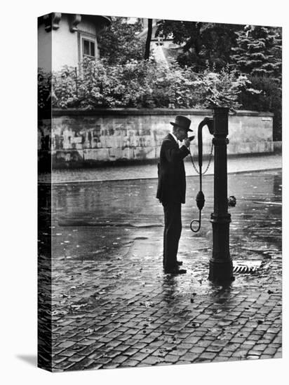 Man Drinking from Public Water Pump Fountain on Street, Frankfort-On-The-Main, Germany-Alfred Eisenstaedt-Premier Image Canvas