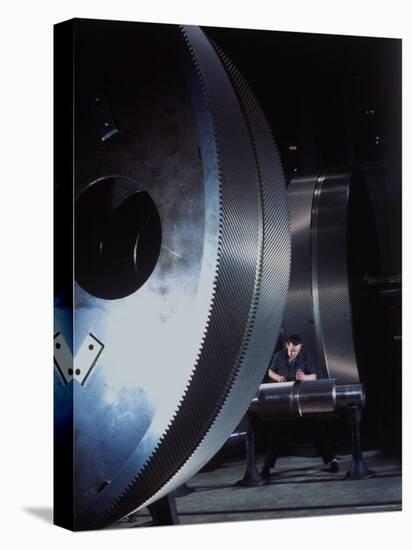 Man Dwarfed by Gigantic Gears He is Working on for the Navy, at General Electric Plant in US-Dmitri Kessel-Premier Image Canvas