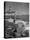 Man Fishing Off Montauk Point. Montauk Lighthouse Visible in Background-Alfred Eisenstaedt-Premier Image Canvas