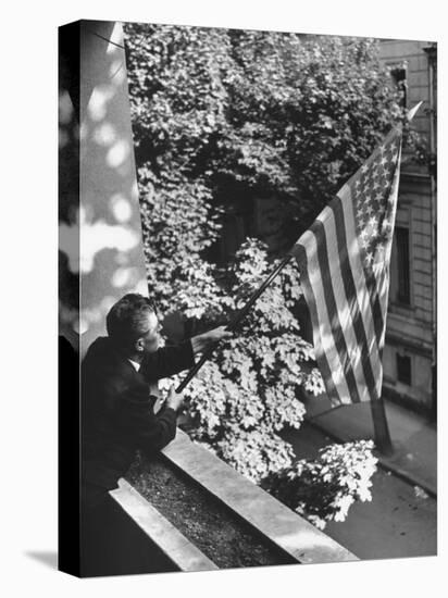 Man Hanging the American Flag Out of the Osteopath's Office Window During WWII-George Strock-Premier Image Canvas