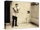 Man Is Sprinkling Boy with Water from Watering Can, 20th Century-Andrew Pitcairn-knowles-Premier Image Canvas