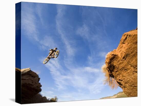 Man Jumps Gap at Red Bull Rampage Site, Virgin, Utah, USA-Chuck Haney-Premier Image Canvas