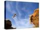 Man Jumps Gap at Red Bull Rampage Site, Virgin, Utah, USA-Chuck Haney-Premier Image Canvas