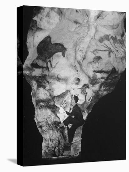 Man Looking at Prehistoric Cave Painting-Ralph Morse-Premier Image Canvas