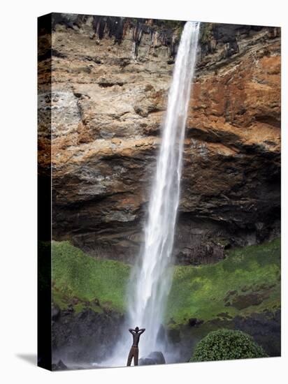 Man Looks Up at Sipi Falls, Uganda, East Africa, Africa-Andrew Mcconnell-Premier Image Canvas