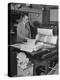 Man Operating Printing Press on Queen Elizabeth-Ed Clark-Premier Image Canvas