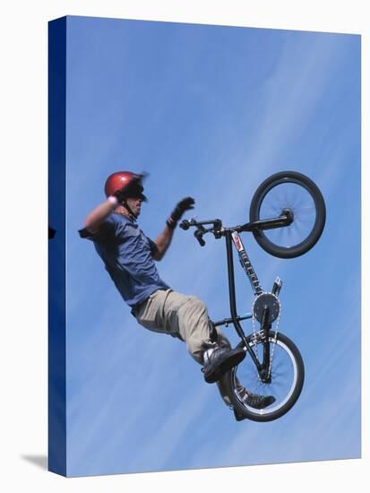 Man Performing Trick on a Bicycle-null-Premier Image Canvas