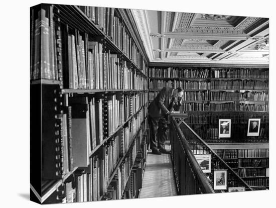 Man Reading Book Among Shelves on Balcony in New York Public Library-Alfred Eisenstaedt-Premier Image Canvas