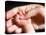 Man's Hand Holding Baby's Hand-Mitch Diamond-Premier Image Canvas