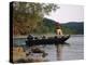 Man Standing in a Boat Fishing-null-Premier Image Canvas