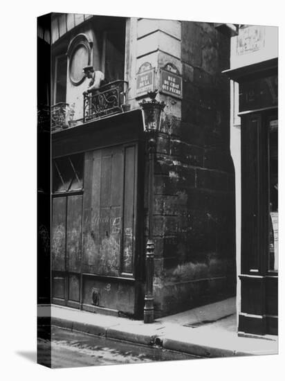 Man Standing on a Balcony over a Lamp Post on the Rue de La Huchette-David Scherman-Premier Image Canvas