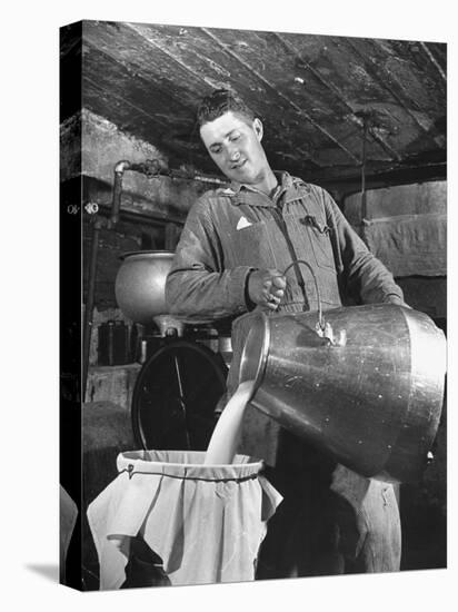 Man Straining Milk into a Can Through a Piece of Cloth-Hansel Mieth-Premier Image Canvas