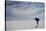 Man Walking With Blue Umbrella On The Bonneville Salt Flats-Lindsay Daniels-Premier Image Canvas