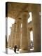 Man Walks Underneath the Giant Columns of the Hypostyle Hall in the Ramesseum, Luxor-Julian Love-Premier Image Canvas