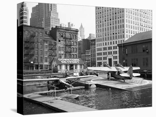 Manhattan's East River Downtown Skyport - Grumman and Fairchild Amphibious Planes-Margaret Bourke-White-Premier Image Canvas