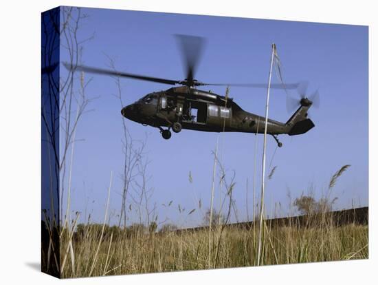 March 31, 2007, a US Army UH-60 Black Hawk Helicopter Prepares to Pick up Soldiers-Stocktrek Images-Premier Image Canvas