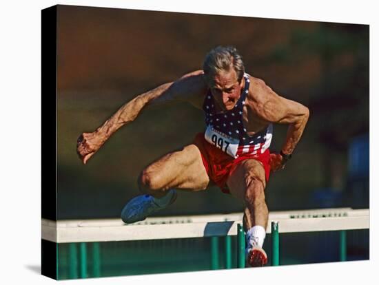 Mature Athlete Competes in Hurdles Race, Atlanta, Georgia, USA-Paul Sutton-Premier Image Canvas