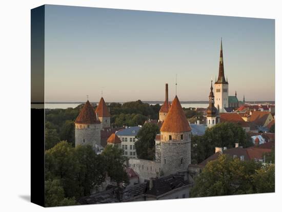 Medieval Town Walls and Spire of St. Olavs Church at Dusk, Tallinn, Estonia, Baltic States, Europe-Neale Clarke-Premier Image Canvas