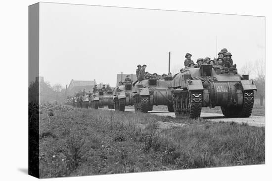 Members of the British 49th Armoured Personnel Carrier Regiment Riding Along a Line of Tanks-George Silk-Premier Image Canvas