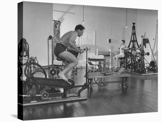 Men Exercising in Gymnasium at Homestead Hotel-John Phillips-Premier Image Canvas