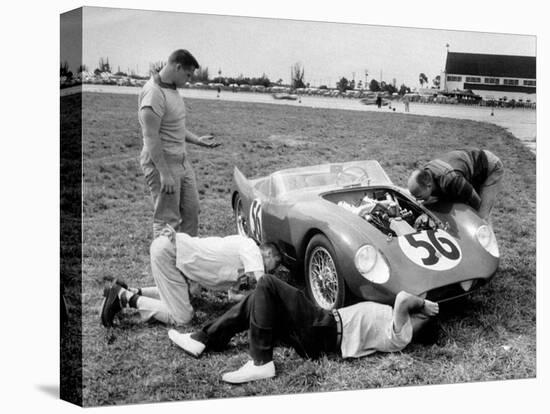 Men Fixing Their Race Car During the Grand Prix-Stan Wayman-Premier Image Canvas