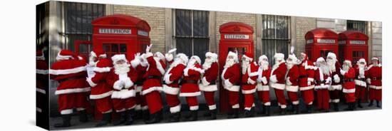 Men from the London Santa School, Dressed in Christmas Outfits, Pose by Telephone Boxes in London-null-Premier Image Canvas