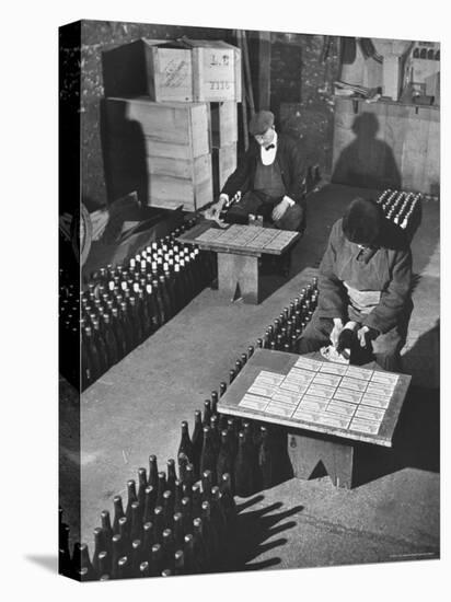 Men Putting Labels on Wine Bottles-Ralph Morse-Premier Image Canvas