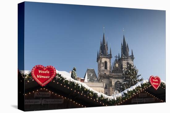 Merry Christmas Sign at Snow-Covered Christmas Market and Tyn Church-Richard Nebesky-Premier Image Canvas