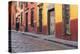 Mexico, San Miguel de Allende. Elderly man walks up sidewalk.-Don Paulson-Premier Image Canvas