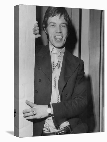 Mick Jagger in a Door-Associated Newspapers-Stretched Canvas