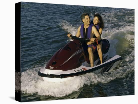 Mid Adult Couple Riding a Jet Ski-null-Premier Image Canvas