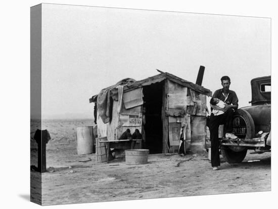 Migrant Father Cradling His Baby Outside Shanty-Dorothea Lange-Premier Image Canvas