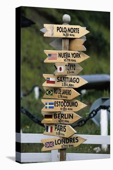 Mileage Sign Pointing Directions in Puerto Williams-Paul Souders-Premier Image Canvas