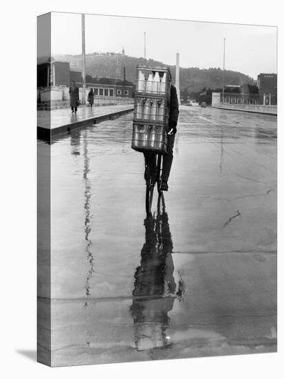 Milkman Riding on Slippery Road-null-Premier Image Canvas