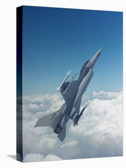 Missile-Armed Us F-16 Fighter Aircraft in Flight, Climbing Above Clouds-null-Premier Image Canvas