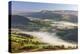 Mist covered rolling countryside backed by the Black Mountains, Brecon Beacons National Park, Powys-Adam Burton-Premier Image Canvas