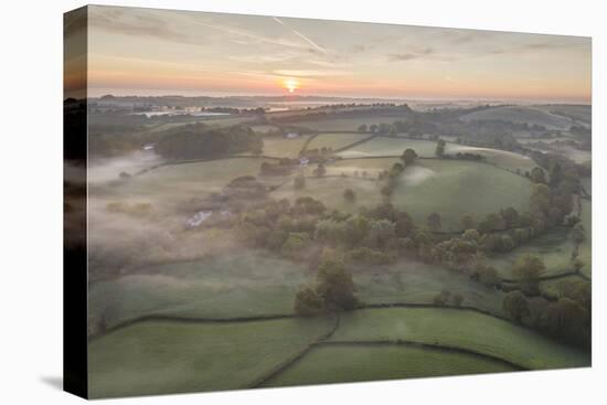 Misty spring sunrise over rolling countryside, South Tawton, Devon, England, United Kingdom, Europe-Adam Burton-Premier Image Canvas