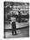 Model Posing Beside Cadillac Eldorado Captures Attention of Young Boy at National Automobile Show-Walter Sanders-Premier Image Canvas