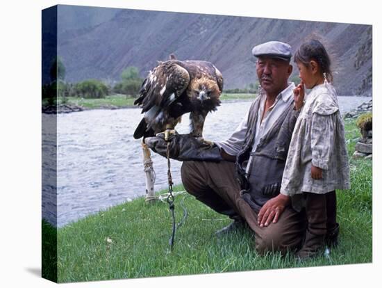 Mongolia, Kasakh Hunter with Eagle by the Khovd River, with a Small Child-Antonia Tozer-Premier Image Canvas