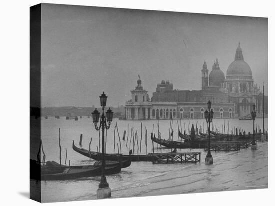 Moored Gondolas in Grand Canal by Flooded Piazza San Marco with Santa Maria Della Salute Church-Dmitri Kessel-Premier Image Canvas