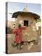 Mopti, A Bobo Man Beside His Millet Granary at a Bobo Village Near Mopti, Mali-Nigel Pavitt-Premier Image Canvas