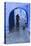 Morocco, Chefchaouen. Bicyclist Rides Past Cat in Archway in the Blue Village of Chefchaouen-Brenda Tharp-Premier Image Canvas