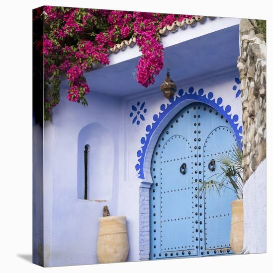 Morocco, Chefchaouen. Bougainvillea Blossoms Frame an Ornate Blue Door-Brenda Tharp-Premier Image Canvas