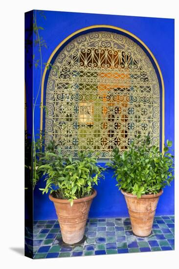 Morocco, Marrakech, Blue Building Exterior Surrounded by Plants-Emily Wilson-Premier Image Canvas