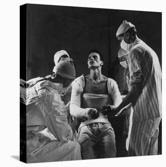 Mortar Wounded Army Medic Private George Lott, Sitting Up While 4 Army Surgeons Finish Up His Cast-Ralph Morse-Premier Image Canvas